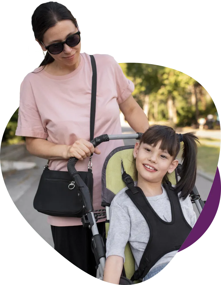 NDIS support worker assisting child participant with mobility and outdoor community access